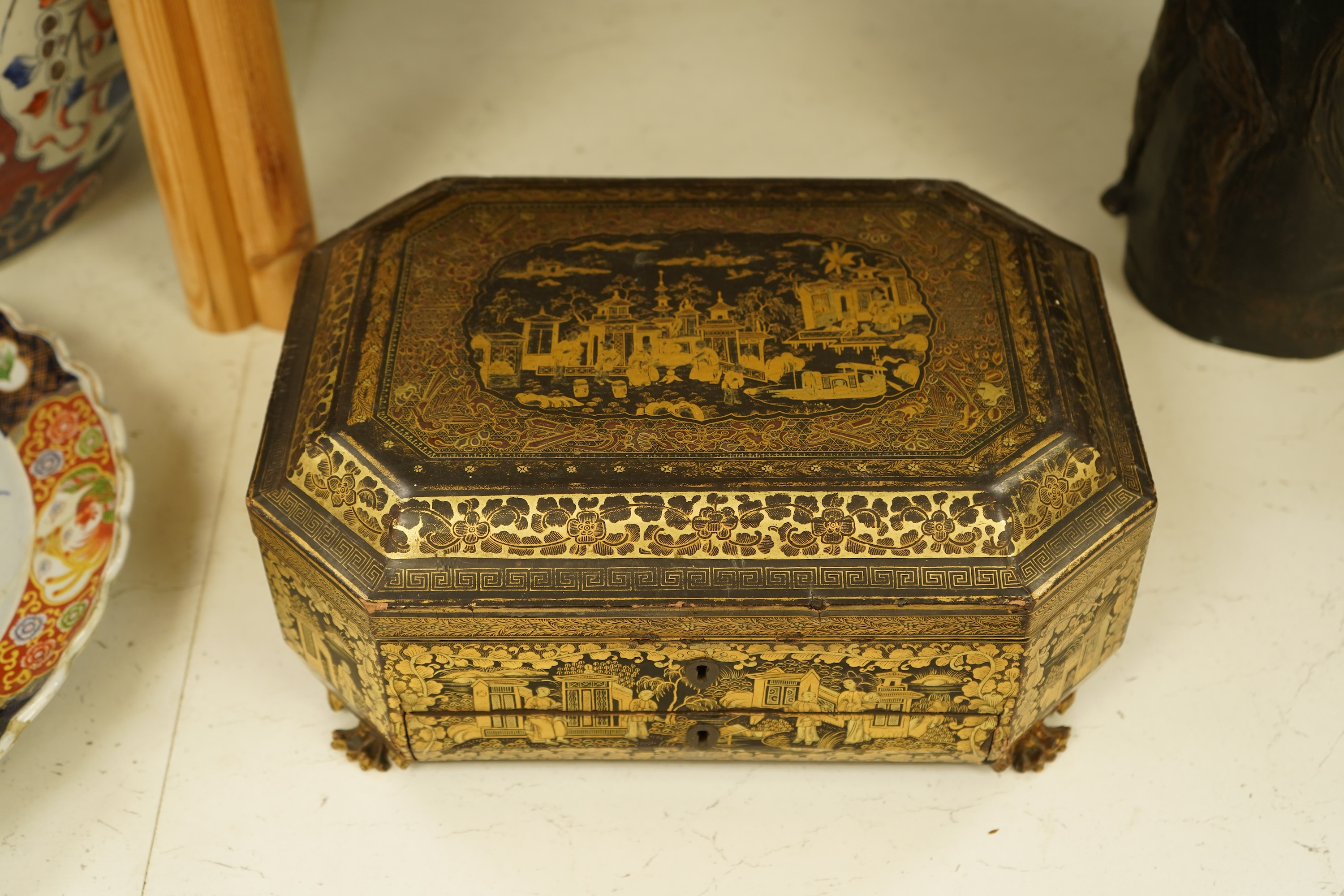 A Chinese export octagonal lacquered work box with fitted interior, 35cm wide